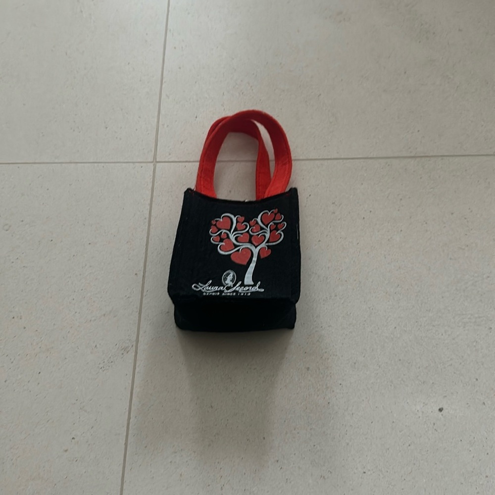 Cute Laura Secord felt mini bag.